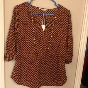 Orange and navy blouse with gold studs